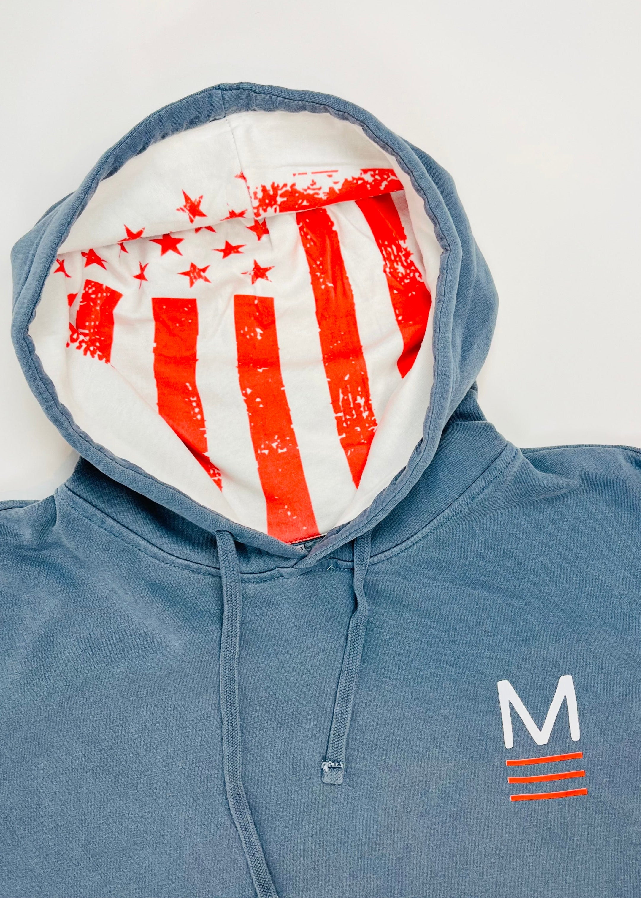 Blue hoodie with American flag pattern inside the hood on a white background