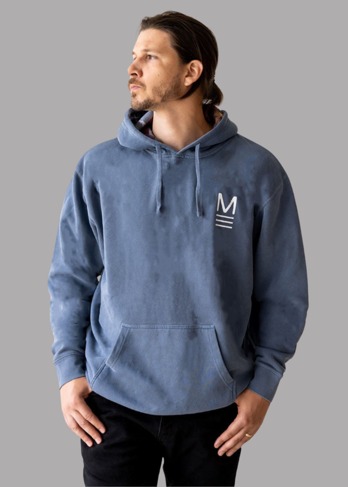Male wearing a blue hoodie with a Maverson "M" logo on a gray background. American Made. Raising the Flag on Iwo Jima. Honor. First Responder. Police. Military. Firefighter. Supports. Gift for Dad, grandpa.