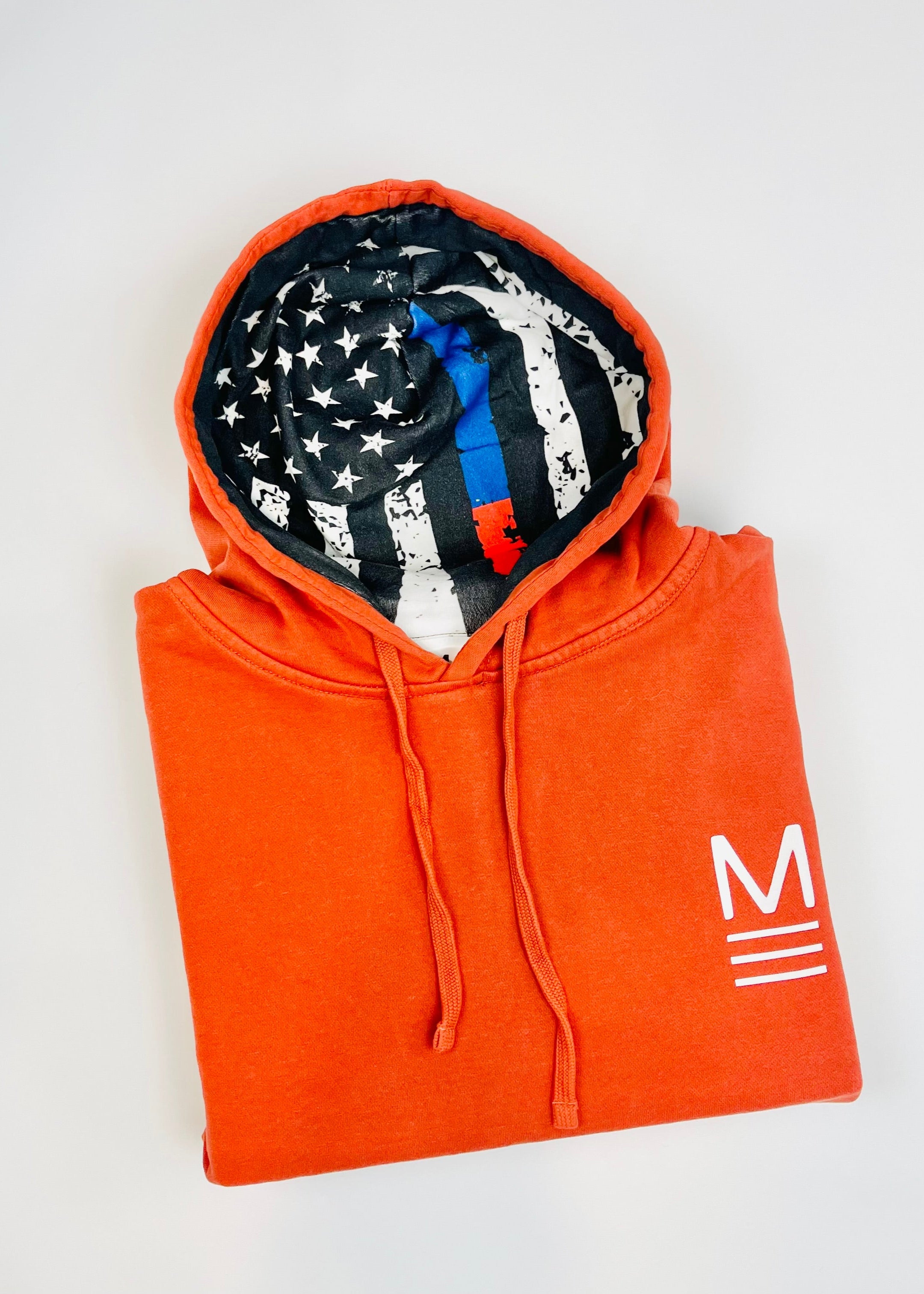 Red hoodie with a flag pattern inside the hood on a white background