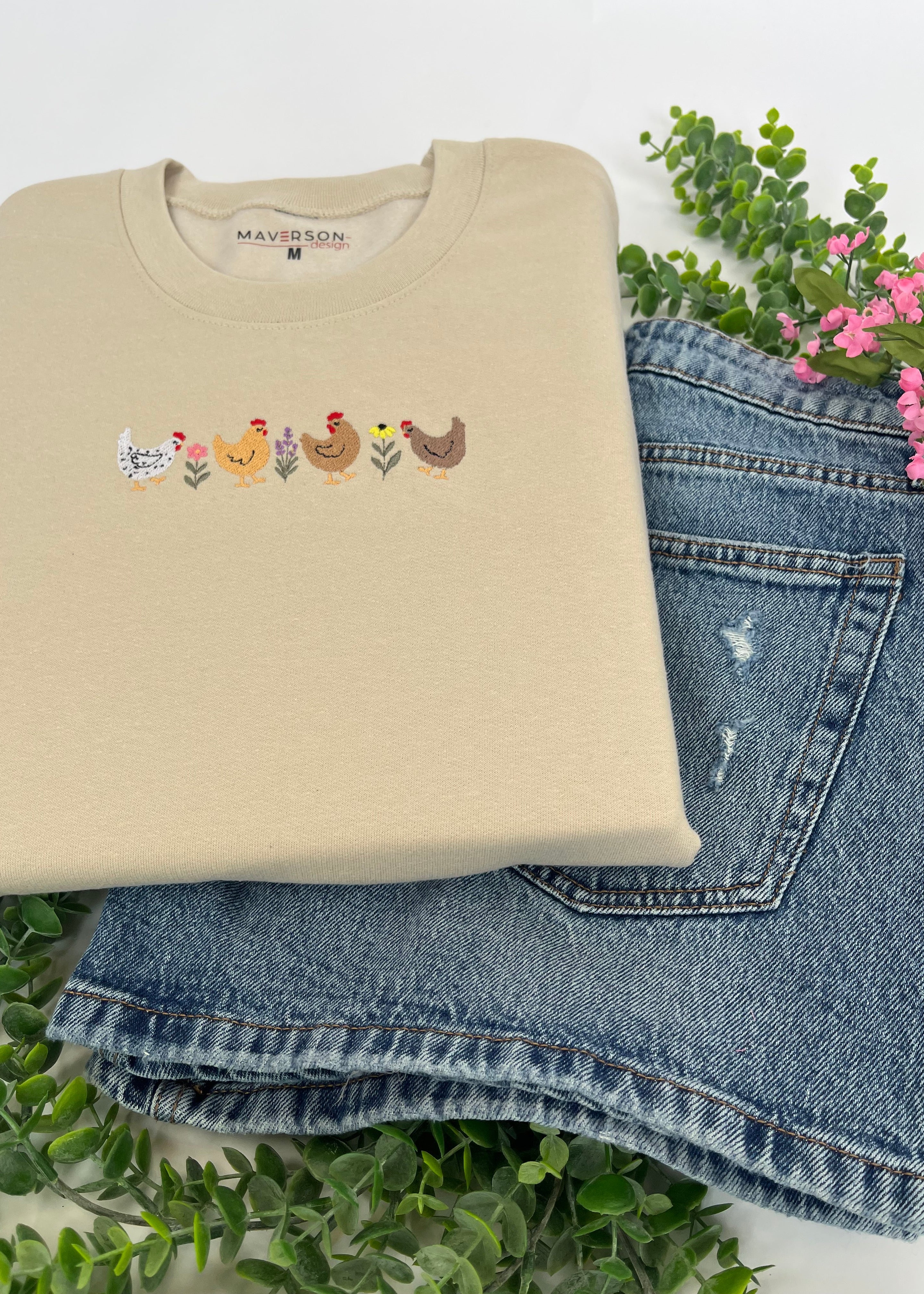 Beige t-shirt with chicken design on a white background